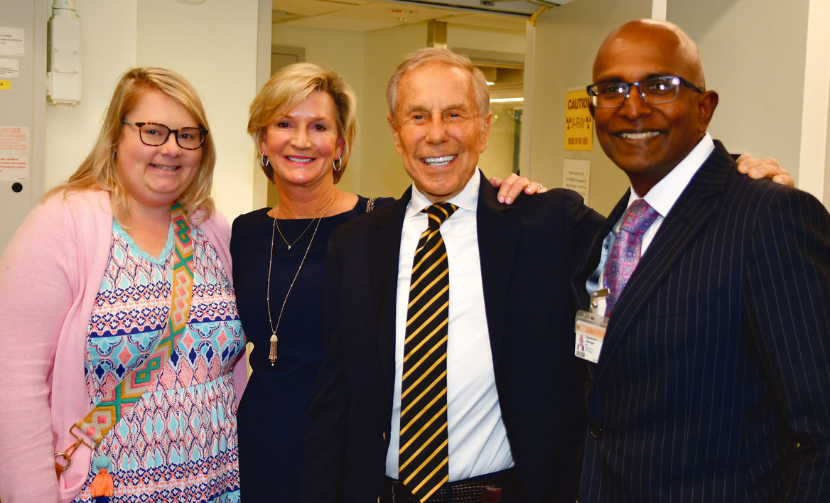 A photo of the Cottrell family with Vigneshwar Kasirajan, M.D., Stuart McGuire Chair of the VCU Department of Surgery