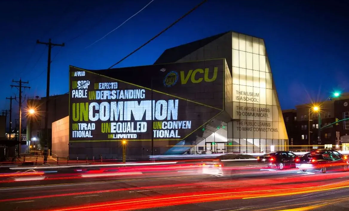 A photo of the ICA at VCU with university branding projected onto walls