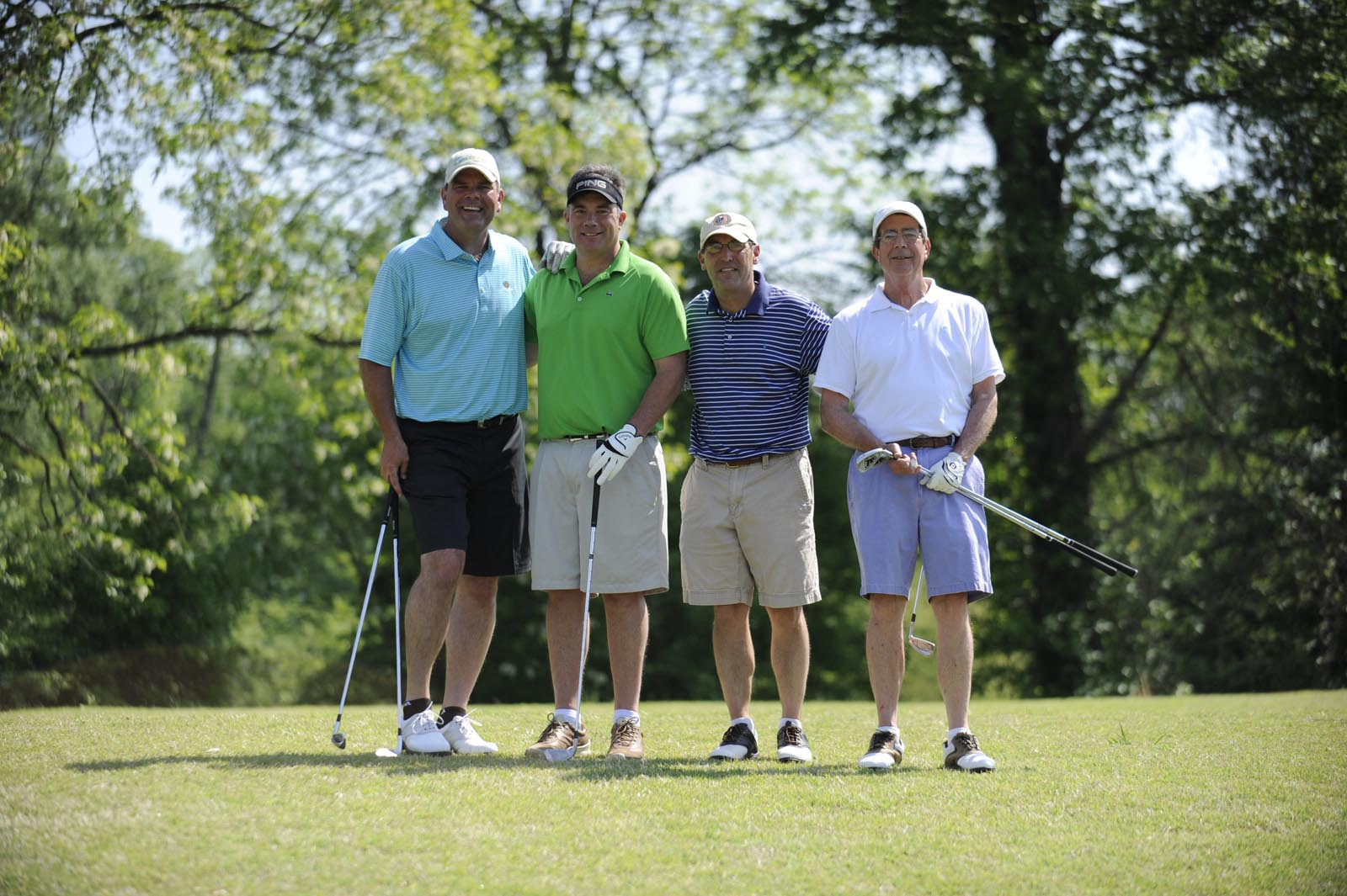 Four golf attendees